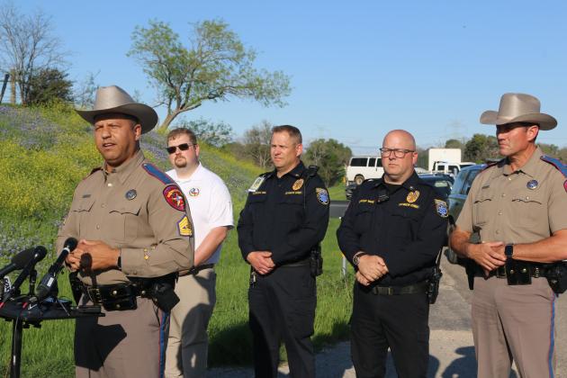 Sgt. Deon Cockrell, Texas Department of Public Safety, provides an update after a fatal collision between a Hays Consalidated Independent School District bus and a concrete truck. Photo by Jason Hennington