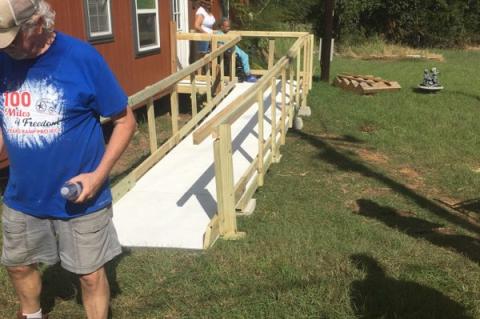 A new ramp is installed at an Elgin home Sept. 17 courtesy of the Elgin Ramp Crew. In the background, Mary Haywood is helped onto the ramp for the first time by her daughter, Deborah.Courtesy photo