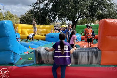 Volunteers had their hands full at the Hogeye festival’s inflatable game stations, a new addition to the celebration. Photo by Niko Demetriou