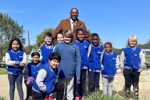  Charles Wilson with his second and third graders, out for recess in their custom TNT Academy jackets. Photo by Niko Demetriou