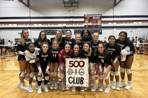 Lady Bears varsity volleyball sophomore Abby Thomas and her teammates celebrate with a photo on Sept. 19 to congratulate her on 500 career digs, which she achieved during Bastrop’s home match win vs. Pflugerville Connally High School. Photo courtesy of Morgan Rollins