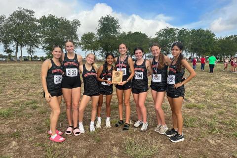 The Smithville High School girls varsity cross country team proudly poses on Thursday, Sept. 21 after the Lady Tigers placed first at the Lake Belton Bronco Invitational meet. Photo courtesy of Smithville Lady Tiger Athletics