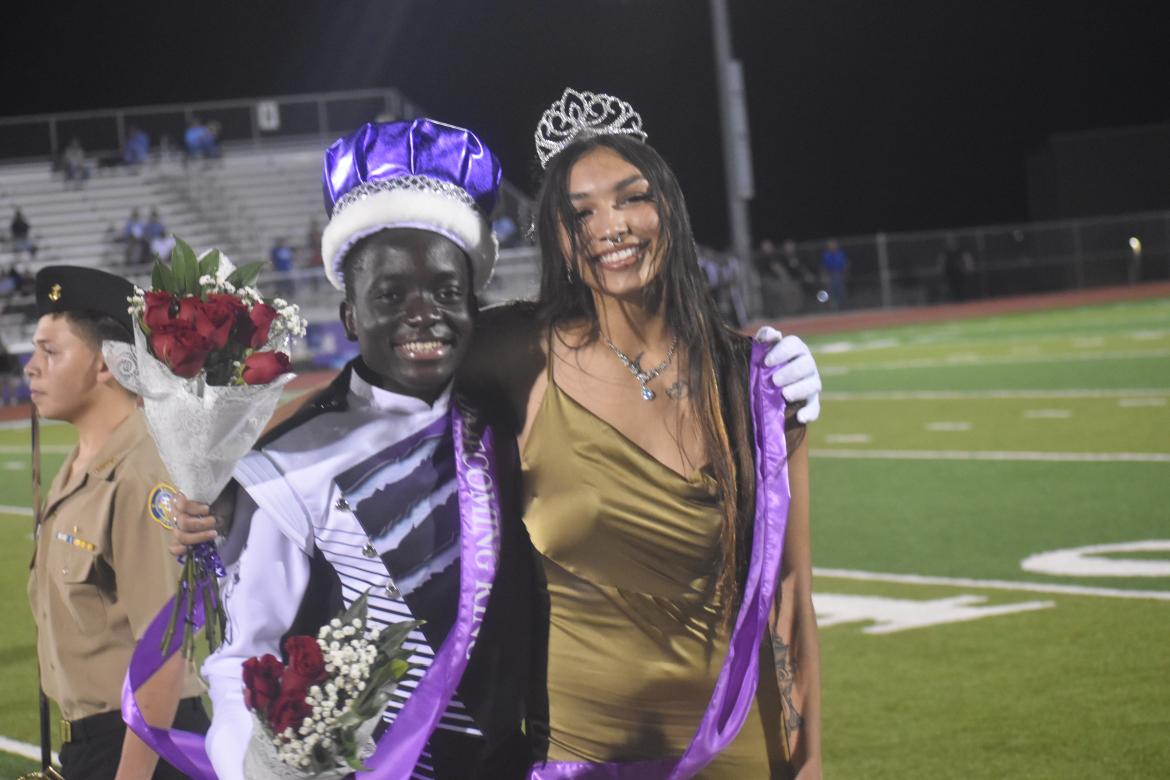 Homecoming king and queen, John Ukanda and Lauren Hiracheta, ecstatic to have been elected by their peers. Photo by Quinn Donoghue