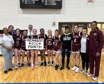 Bastrop High School girls varsity basketball sophomore Kenadee Lawhon poses with teammates and coaches Jan. 19 following the Lady Bears’ game at Georgetown High School to celebrate her 500th career point scored. Photo courtesy of Bastrop ISD