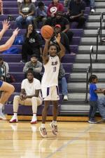 Elgin High School boys varsity basketball junior Zaire Nuells (11) puts up a shot Nov. 20 during the Wildcats’ home game against Jarrell High School. Photo by Erin Anderson